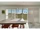 Sunroom with sliding glass doors, tiled floors, and a rustic wooden table at 2407 Locksley St # 224, Sun City Center, FL 33573