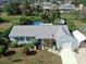 Bird's-eye view of a light blue house with a pool and backyard at 2575 Shenandoah St, North Port, FL 34287