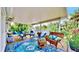 Covered patio with comfortable seating, perfect for relaxing outdoors at 2575 Shenandoah St, North Port, FL 34287