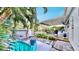 Peaceful backyard with patio, fire pit, and tropical landscaping at 2575 Shenandoah St, North Port, FL 34287