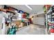 Spacious garage with ample storage shelving and overhead storage at 2575 Shenandoah St, North Port, FL 34287