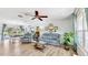 Spacious living room with light gray couches and a large TV at 2575 Shenandoah St, North Port, FL 34287