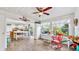 Bright sunroom offering views of the backyard and kitchen access at 2575 Shenandoah St, North Port, FL 34287