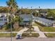 Aerial view of a charming house with a circular driveway at 3953 Arkansas Ave Ne, St Petersburg, FL 33703