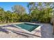 Private backyard with a refreshing square pool and brick patio at 3953 Arkansas Ave Ne, St Petersburg, FL 33703