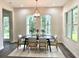 Elegant dining room with a modern chandelier and ample natural light at 5062 Elm Leaf Dr, Brooksville, FL 34601