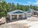 Charming single-Gathering home featuring a spacious front porch and a 2-car garage at 5062 Elm Leaf Dr, Brooksville, FL 34601