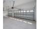 Bright and airy garage with two automatic doors at 5062 Elm Leaf Dr, Brooksville, FL 34601