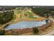 Golf course with pond and surrounding landscape at 5062 Elm Leaf Dr, Brooksville, FL 34601