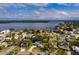 Aerial view of a single Gathering home with pool and large backyard in a quiet residential neighborhood at 5801 Venetian Ne Blvd, St Petersburg, FL 33703