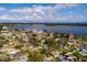 Aerial view of a single Gathering home with pool and large backyard in a quiet residential neighborhood at 5801 Venetian Ne Blvd, St Petersburg, FL 33703