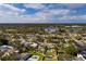 An aerial view of a single-Gathering home with a pool and backyard in a quiet neighborhood at 5801 Venetian Ne Blvd, St Petersburg, FL 33703