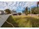 Large backyard with a spacious lawn and a swimming pool at 5801 Venetian Ne Blvd, St Petersburg, FL 33703