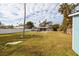 Spacious backyard with a swimming pool and grassy lawn at 5801 Venetian Ne Blvd, St Petersburg, FL 33703