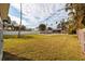 Expansive backyard with a large grassy area and a swimming pool at 5801 Venetian Ne Blvd, St Petersburg, FL 33703