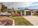 Ranch style home with attached garage and landscaped yard at 5801 Venetian Ne Blvd, St Petersburg, FL 33703