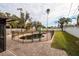 Kidney-shaped swimming pool with safety fence in a backyard setting at 5801 Venetian Ne Blvd, St Petersburg, FL 33703