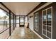 Screened-in porch with tile floors and backyard access at 5801 Venetian Ne Blvd, St Petersburg, FL 33703
