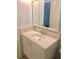 Bathroom features a vanity with sink and mirrored medicine cabinet at 12760 Indian Rocks Rd # 562, Largo, FL 33774