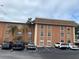 Two-story building exterior with ample parking at 12760 Indian Rocks Rd # 562, Largo, FL 33774