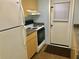Kitchen with wood cabinets, stove, and refrigerator at 12760 Indian Rocks Rd # 562, Largo, FL 33774