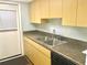 Galley kitchen with light wood cabinets and appliances at 12760 Indian Rocks Rd # 562, Largo, FL 33774