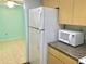Kitchen area with microwave and refrigerator at 12760 Indian Rocks Rd # 562, Largo, FL 33774