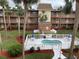Community pool and spa with surrounding landscaping at 12760 Indian Rocks Rd # 562, Largo, FL 33774