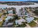 Aerial view of waterfront home with private dock and pool at 1386 40Th Ne Ave, St Petersburg, FL 33703