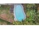 Overhead shot of an inground pool surrounded by green foliage and lounge chairs at 1504 E Mcberry St, Tampa, FL 33610
