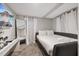 Cozy bedroom featuring a queen-size bed, soft carpet, and bright natural lighting at 1504 E Mcberry St, Tampa, FL 33610