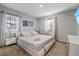 Bright bedroom features plush carpeting, abundant natural light, and minimalist decor at 1504 E Mcberry St, Tampa, FL 33610