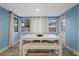 Bright dining area with a white table and bench seating at 1504 E Mcberry St, Tampa, FL 33610