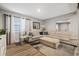 Comfortable living room featuring a sectional sofa and ottoman at 1504 E Mcberry St, Tampa, FL 33610