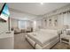 Inviting main bedroom featuring soft carpet, neutral walls, and ample natural light at 1504 E Mcberry St, Tampa, FL 33610