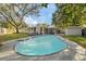 Inviting kidney-shaped swimming pool in the backyard at 1504 E Mcberry St, Tampa, FL 33610