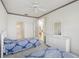 Bedroom with two twin beds, white dresser, and ensuite bathroom at 1637 Sand Key Estates Ct, Clearwater Beach, FL 33767