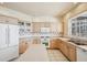 Bright kitchen with island and white appliances at 1637 Sand Key Estates Ct, Clearwater Beach, FL 33767