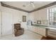 Home office with built-in desk and cabinets at 1637 Sand Key Estates Ct, Clearwater Beach, FL 33767