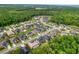 Aerial view of neighborhood with pond at 26888 Fiddlewood Loop, Wesley Chapel, FL 33544
