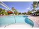 Inviting community pool featuring a convenient handrail at 26888 Fiddlewood Loop, Wesley Chapel, FL 33544