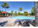 Relaxing community pool with lounge chairs and umbrellas at 26888 Fiddlewood Loop, Wesley Chapel, FL 33544