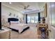 Spacious main bedroom with a plush bed, and plenty of natural light at 26888 Fiddlewood Loop, Wesley Chapel, FL 33544