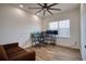 Spacious home office with two computer setups and a brown couch at 26888 Fiddlewood Loop, Wesley Chapel, FL 33544