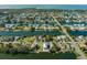 Aerial view of waterfront community with single Gathering homes and canals at 3276 Sea Grape Dr, Hernando Beach, FL 34607