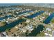 Aerial view of waterfront community with single Gathering homes and canals at 3276 Sea Grape Dr, Hernando Beach, FL 34607