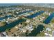 Aerial view of waterfront community with single Gathering homes and canals at 3276 Sea Grape Dr, Hernando Beach, FL 34607