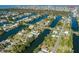 Aerial view of waterfront community with single Gathering homes and canals at 3276 Sea Grape Dr, Hernando Beach, FL 34607