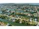Aerial view of waterfront community with single Gathering homes and canals at 3276 Sea Grape Dr, Hernando Beach, FL 34607