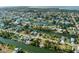 Aerial view of waterfront community with single Gathering homes and canals at 3276 Sea Grape Dr, Hernando Beach, FL 34607